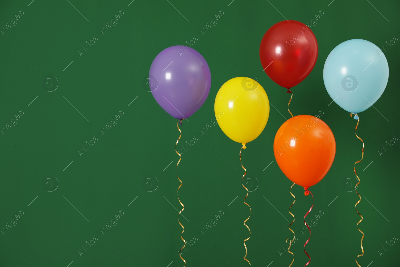 Photo of Bright balloons on color background, space for text. Celebration time