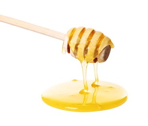 Photo of Natural honey dripping from dipper on white background