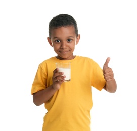 Adorable African-American boy with glass of milk on white background