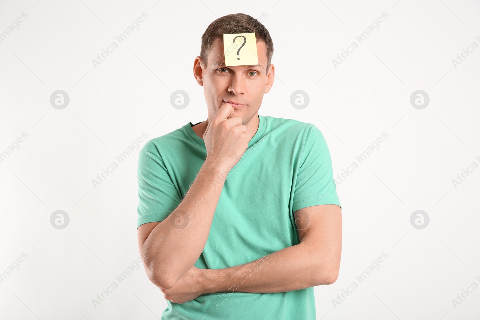 Photo of Thoughtful man with question mark on white background