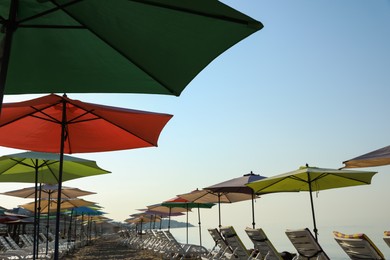 Many beach umbrellas and sunbeds at resort