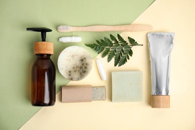 Photo of Eco friendly personal care products and green leaf on color background, flat lay