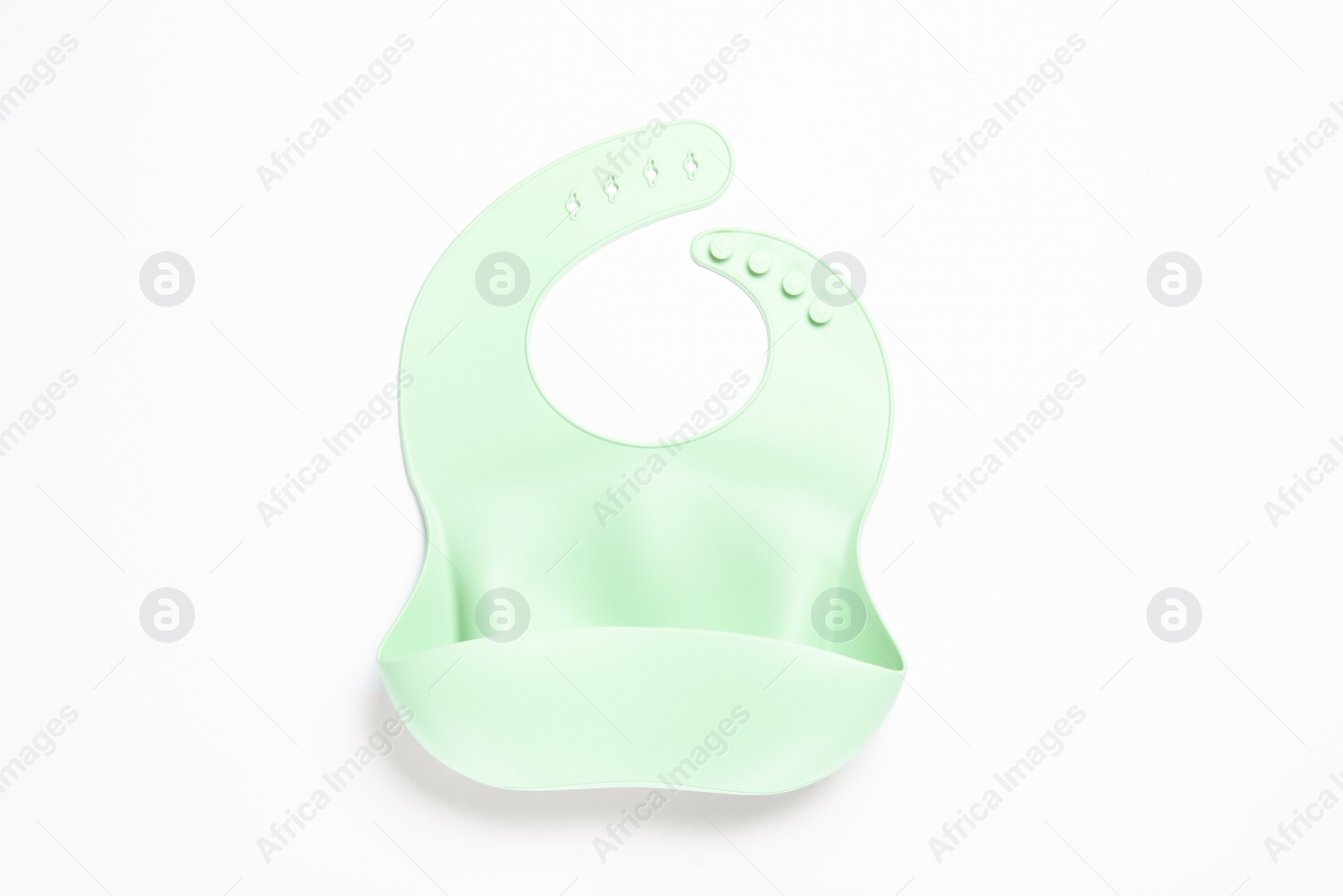 Photo of Mint silicone baby bib isolated on white, top view