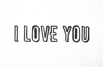 Photo of Handwritten text I Love You on white background
