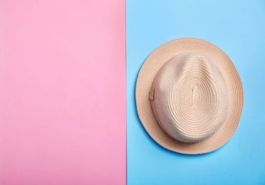 Photo of Stylish hat on color background, top view. Beach resort