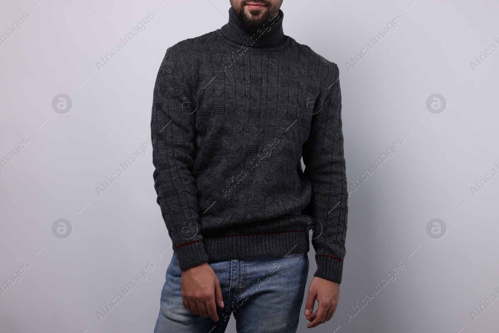 Photo of Man in stylish sweater on white background, closeup