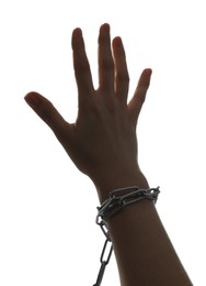 Photo of Freedom concept. Woman with chains on her hand against white background, closeup