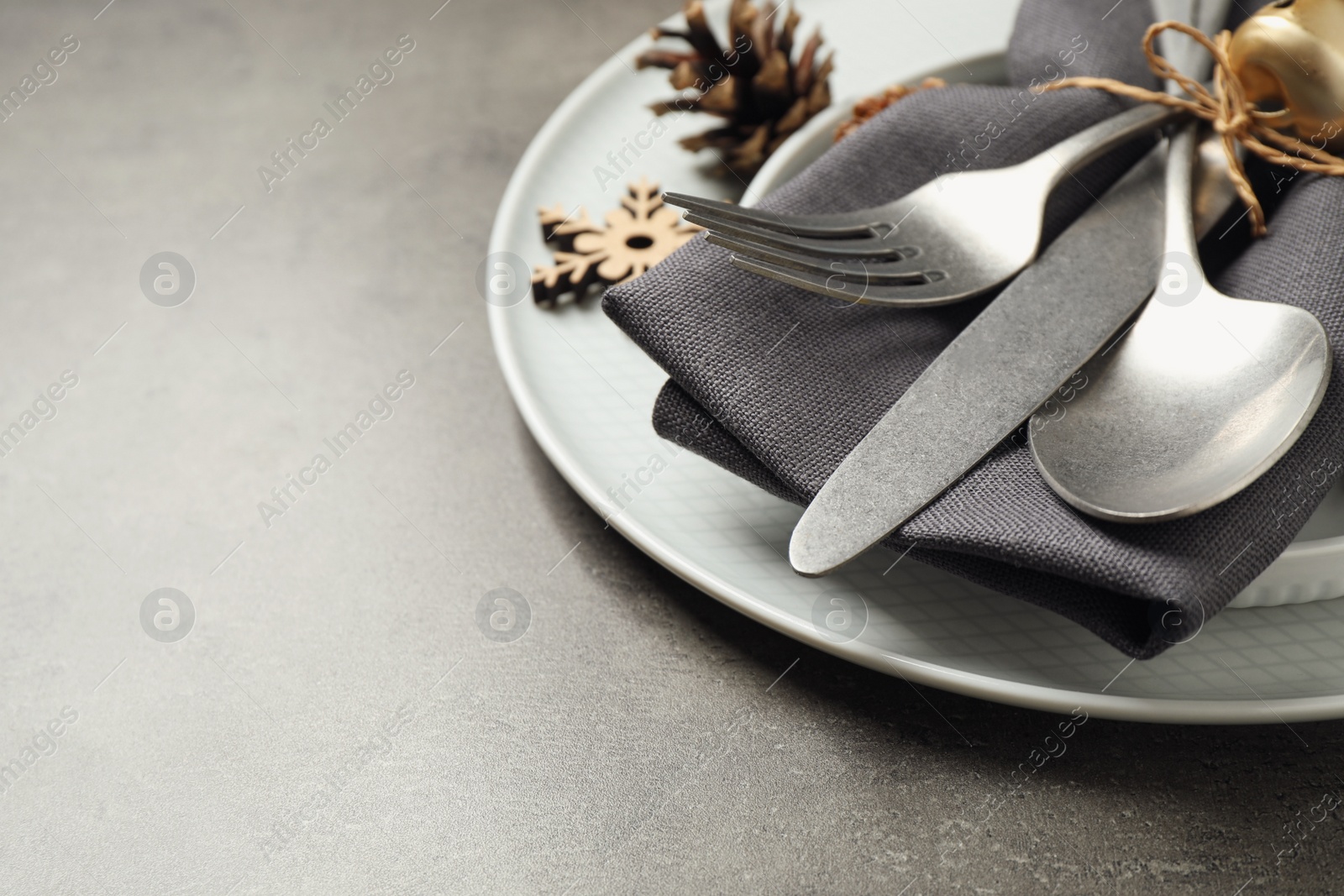 Photo of Beautiful Christmas table setting on grey background. Space for text