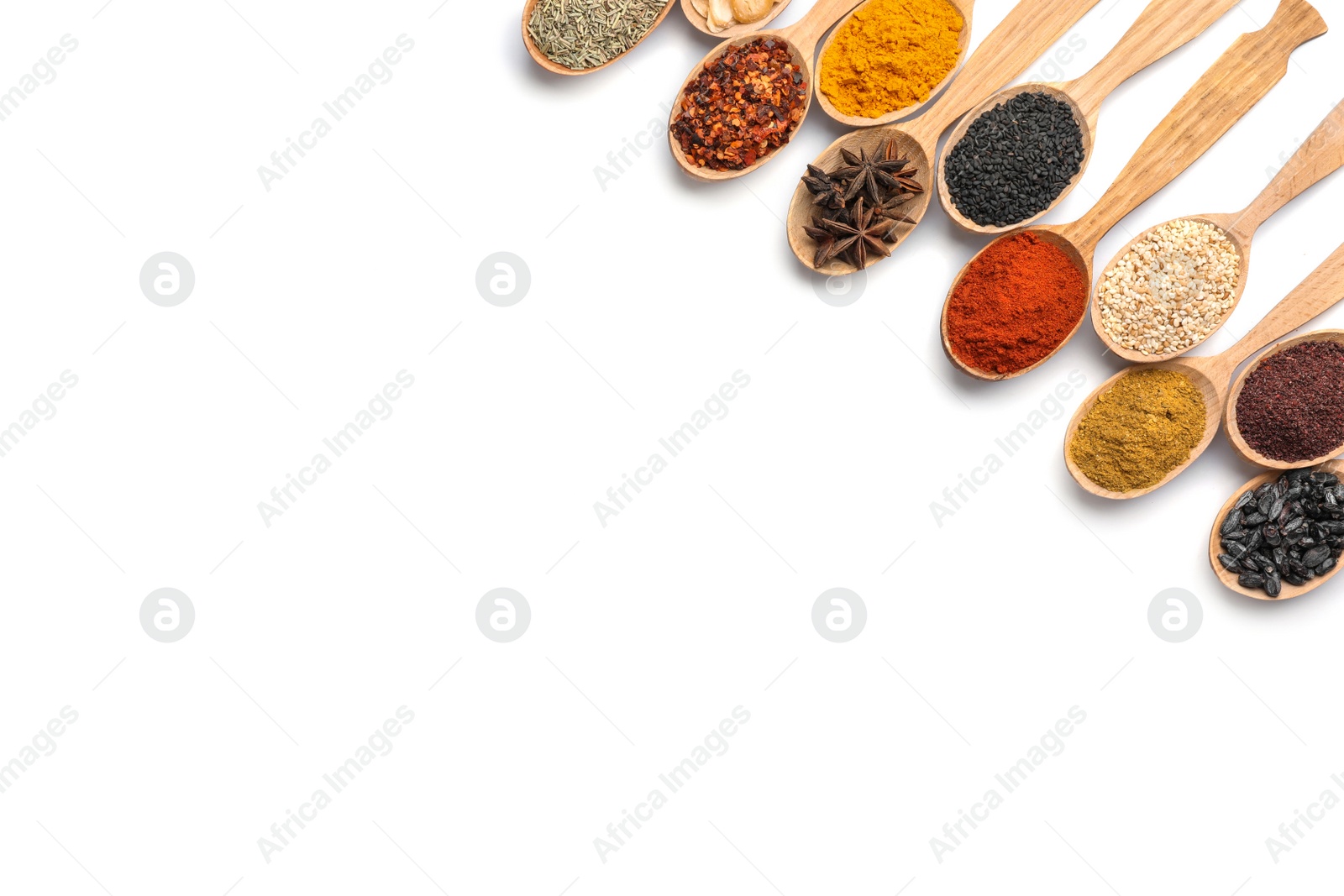 Photo of Composition with different aromatic spices in wooden spoons on white background