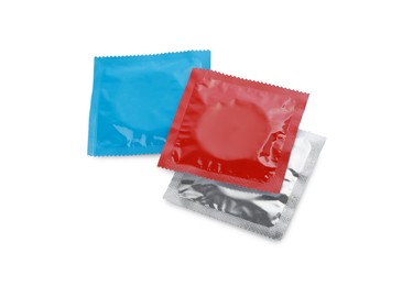Condom packages isolated on white. Safe sex