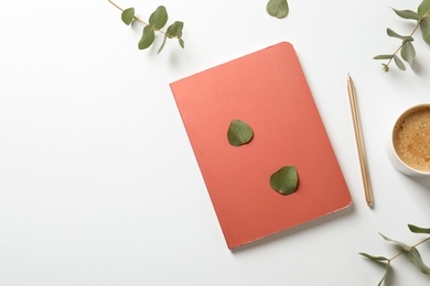 Photo of Flat lay composition with book, cup of coffee and leaves on white background. Space for text