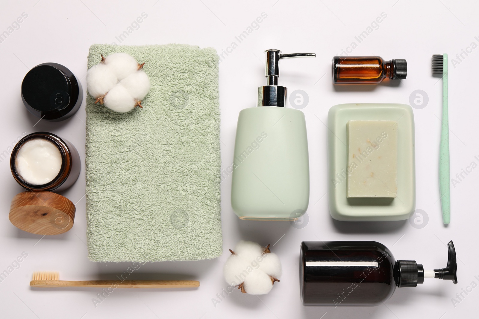 Photo of Bath accessories. Different personal care products and cotton flowers on white background, flat lay