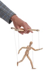Photo of Man pulling strings of puppet on white background, closeup