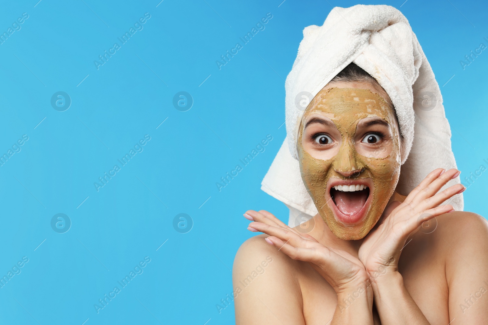 Photo of Emotional woman with mask on face against color background. Space for text