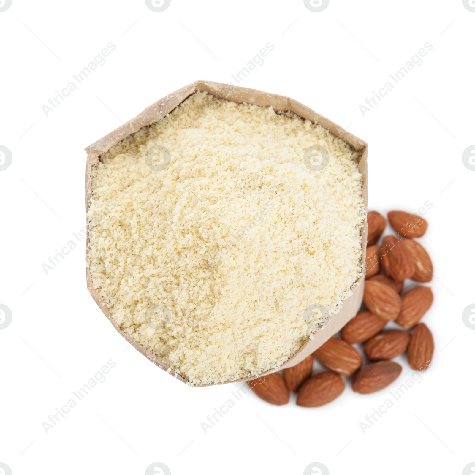 Photo of Paper bag with almond flour and nuts isolated on white, top view