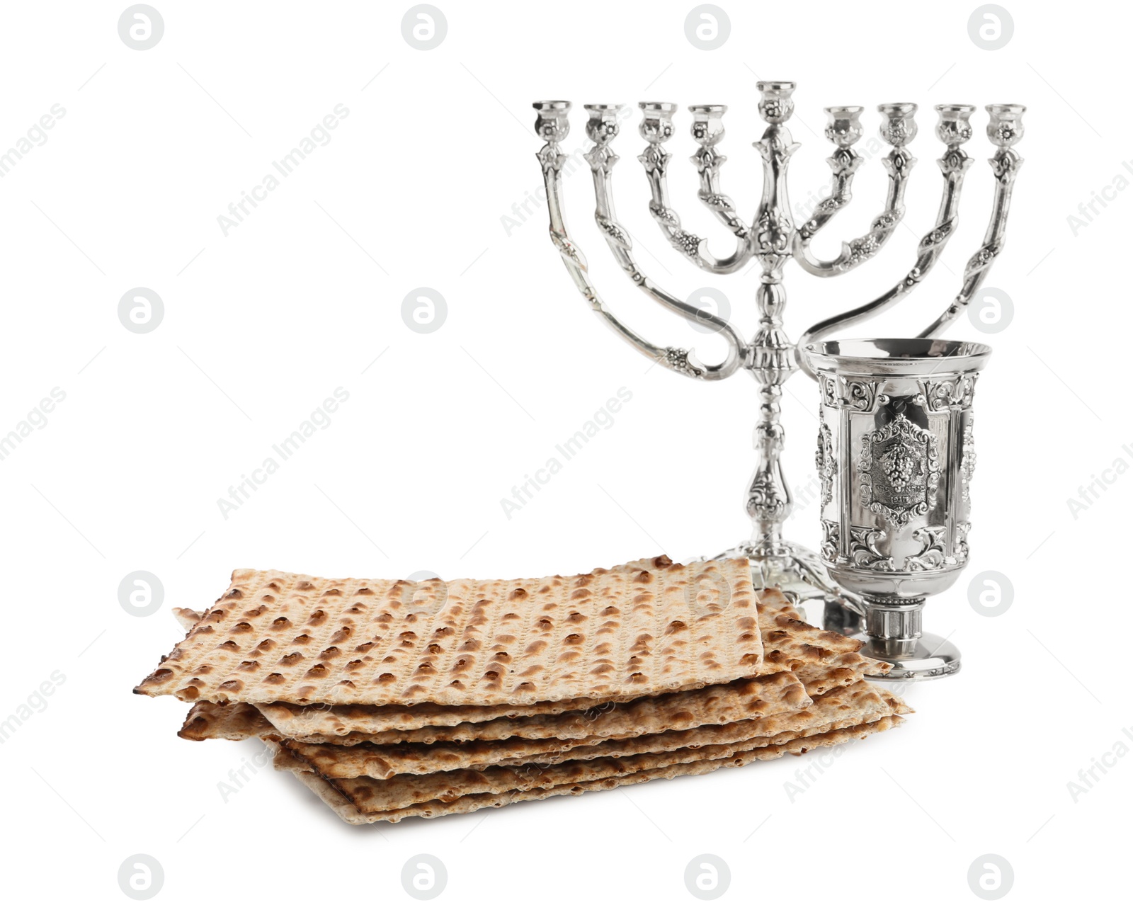 Photo of Traditional matzos, wine and menorah on white background