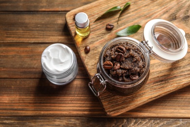 Photo of Glass jar of coffee scrub on wooden board