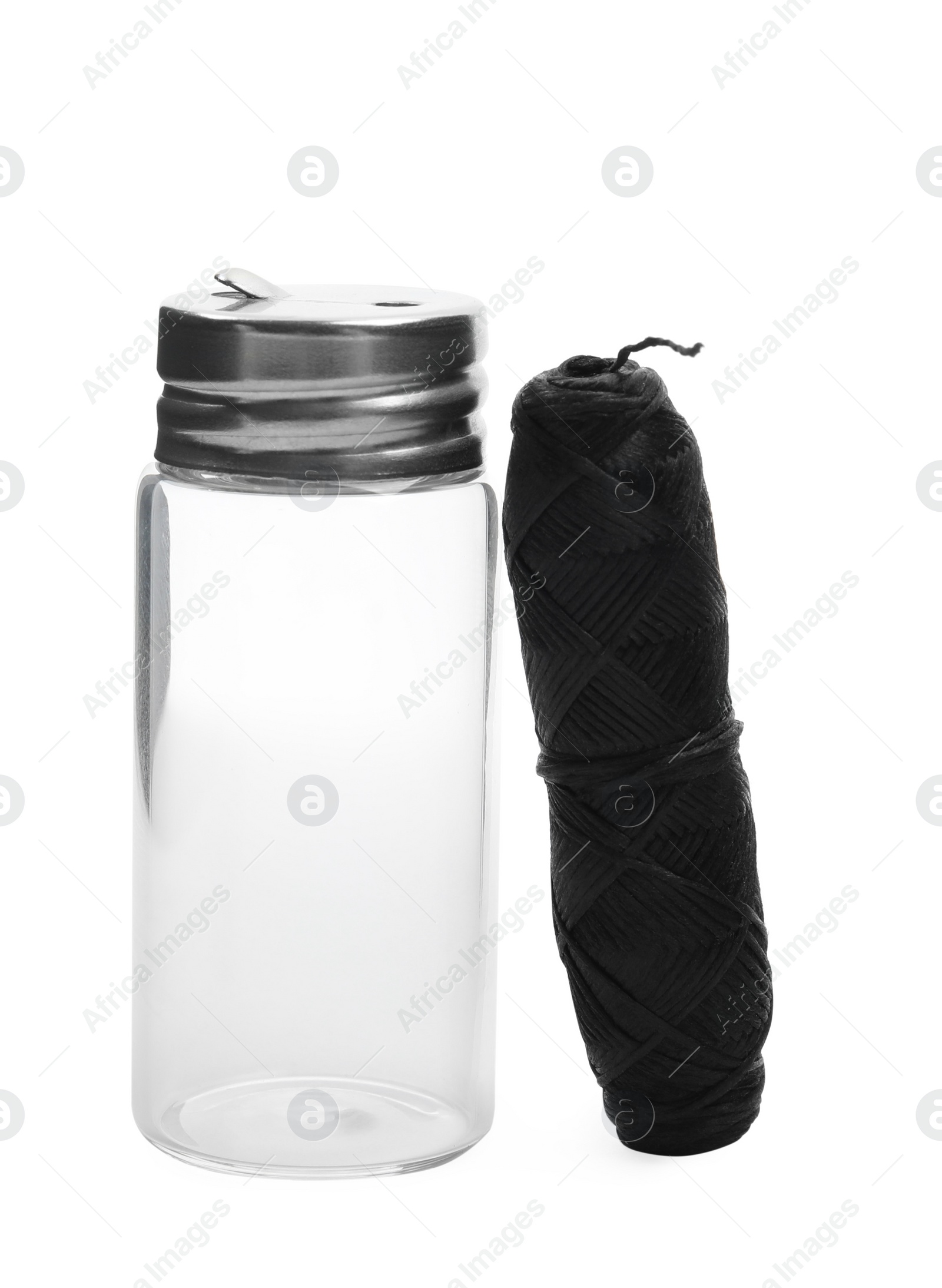 Photo of Roll of natural dental floss and jar on white background