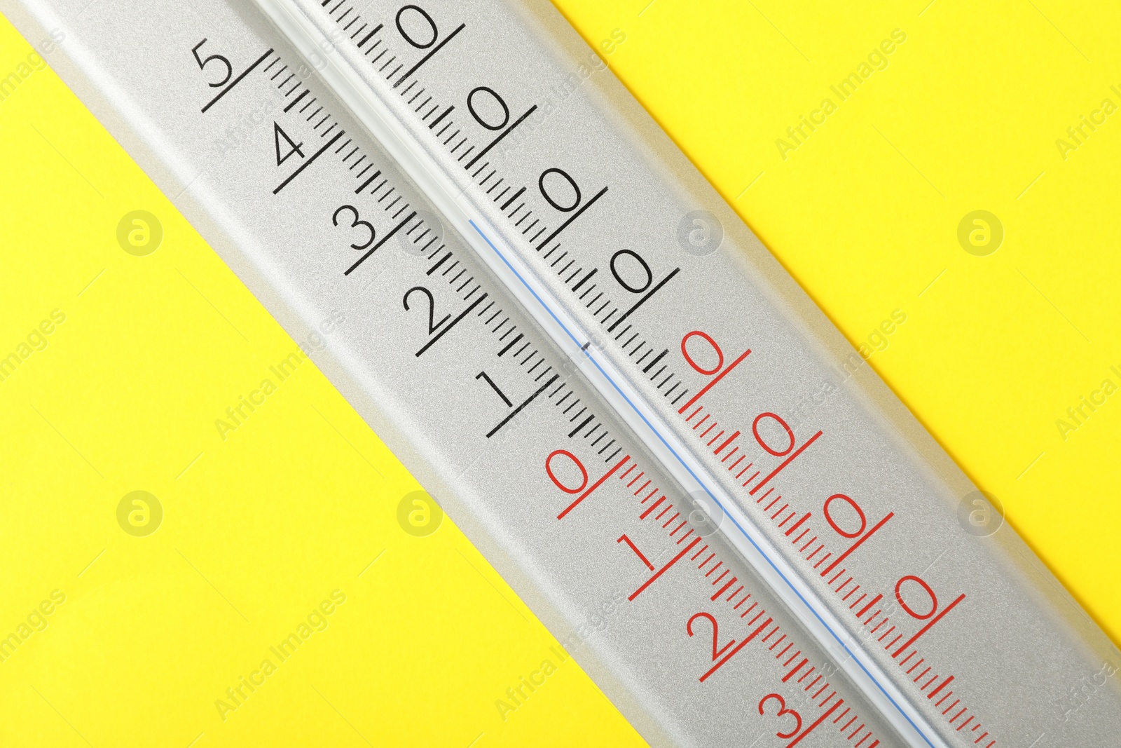 Photo of Modern weather thermometer on yellow background, closeup