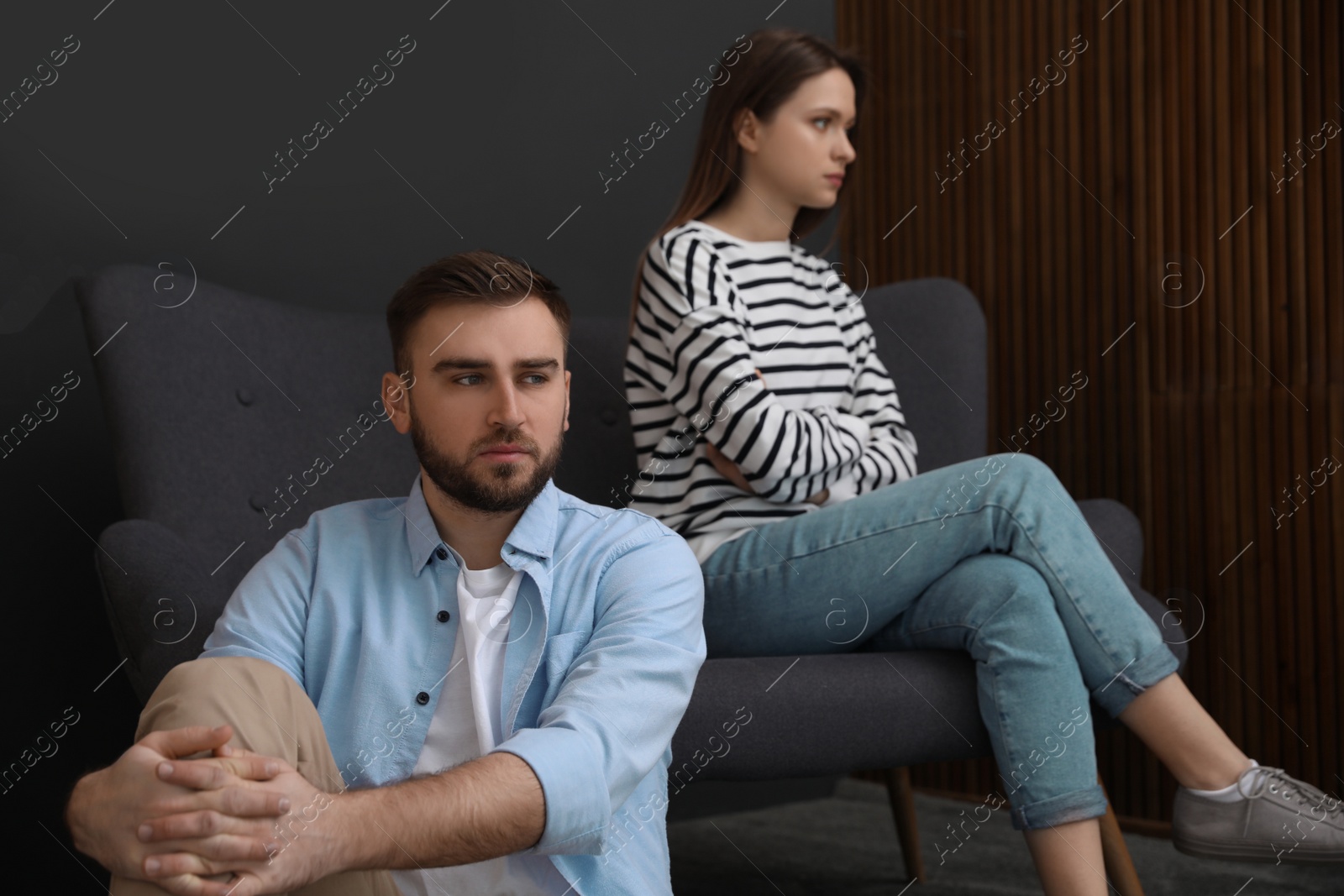 Photo of Unhappy couple with problems in relationship at home