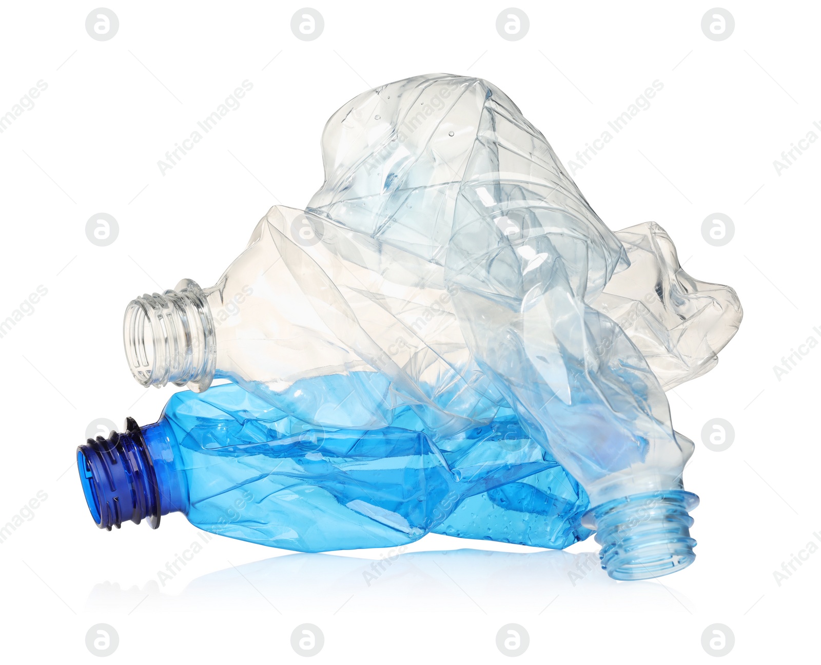 Photo of Crumpled disposable plastic bottles isolated on white