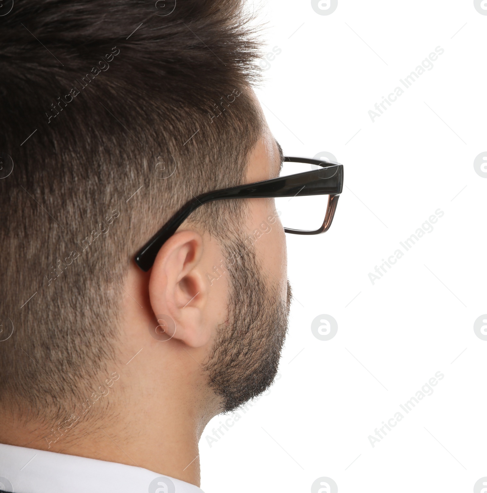 Photo of Young businessman with glasses on white background, closeup