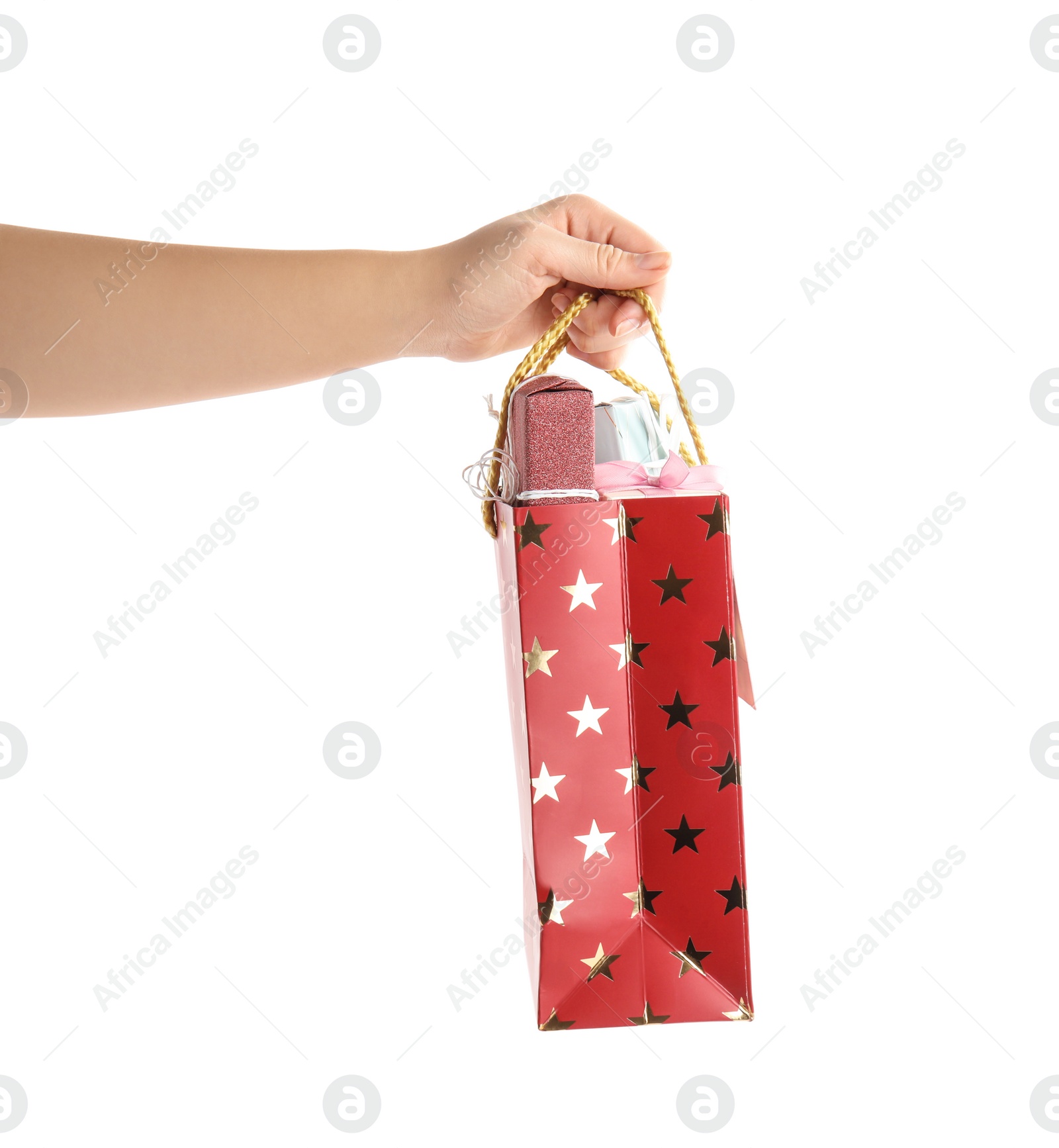 Photo of Woman holding shopping paper bag with presents on white background, closeup