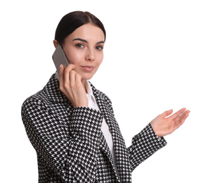 Photo of Young businesswoman talking on mobile phone against white background