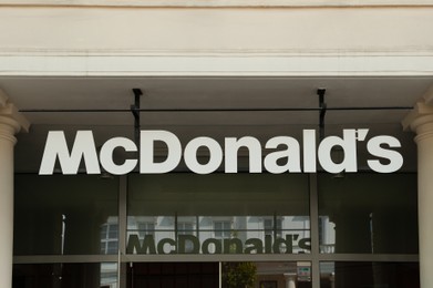 Photo of WARSAW, POLAND - JULY 19, 2022: Signboard with McDonald's Restaurant logo outdoors