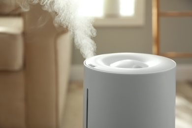 Modern air humidifier at home, closeup view