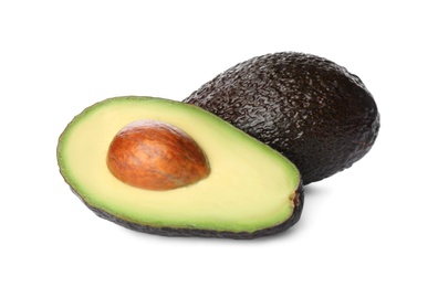 Photo of Cut and whole ripe avocadoes on white background