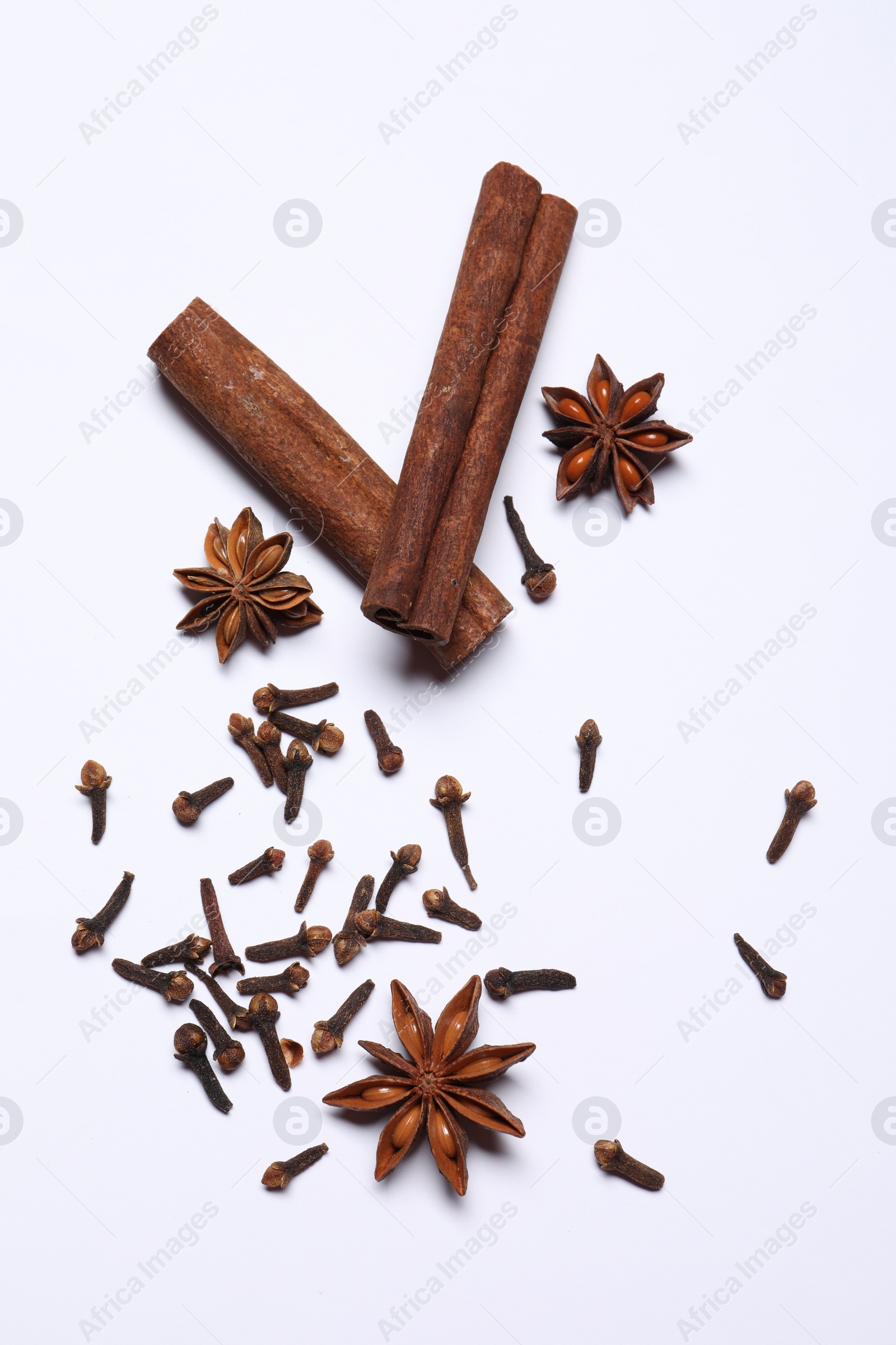 Photo of Different spices on white table, flat lay