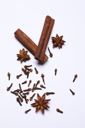 Different spices on white table, flat lay