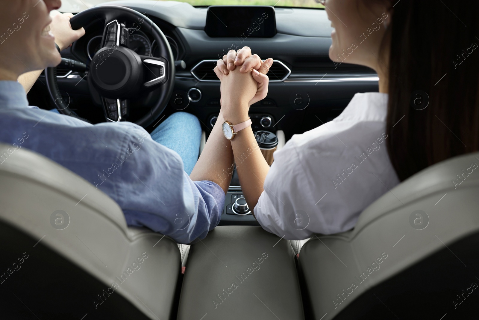 Photo of Happy young couple travelling by car, closeup view