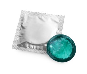 Package with condoms isolated on white. Safe sex