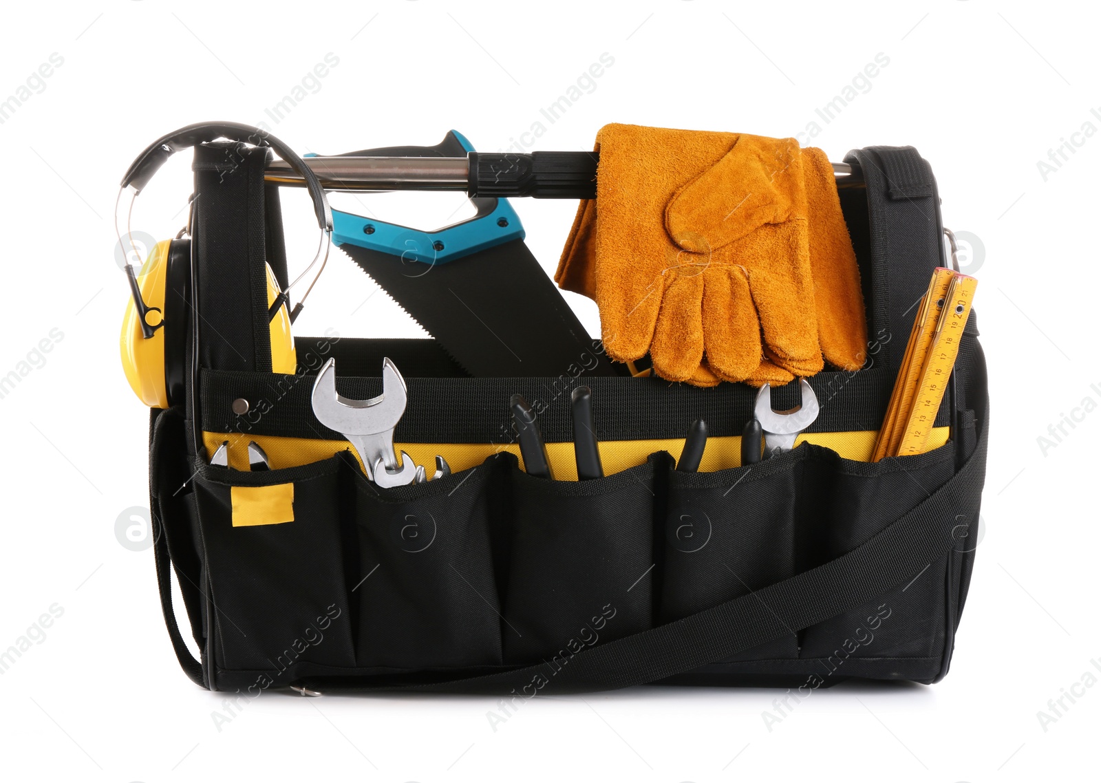 Photo of Organizer bag with construction tools and safety equipment on white background