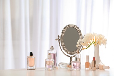 Photo of Perfume bottles on dressing table