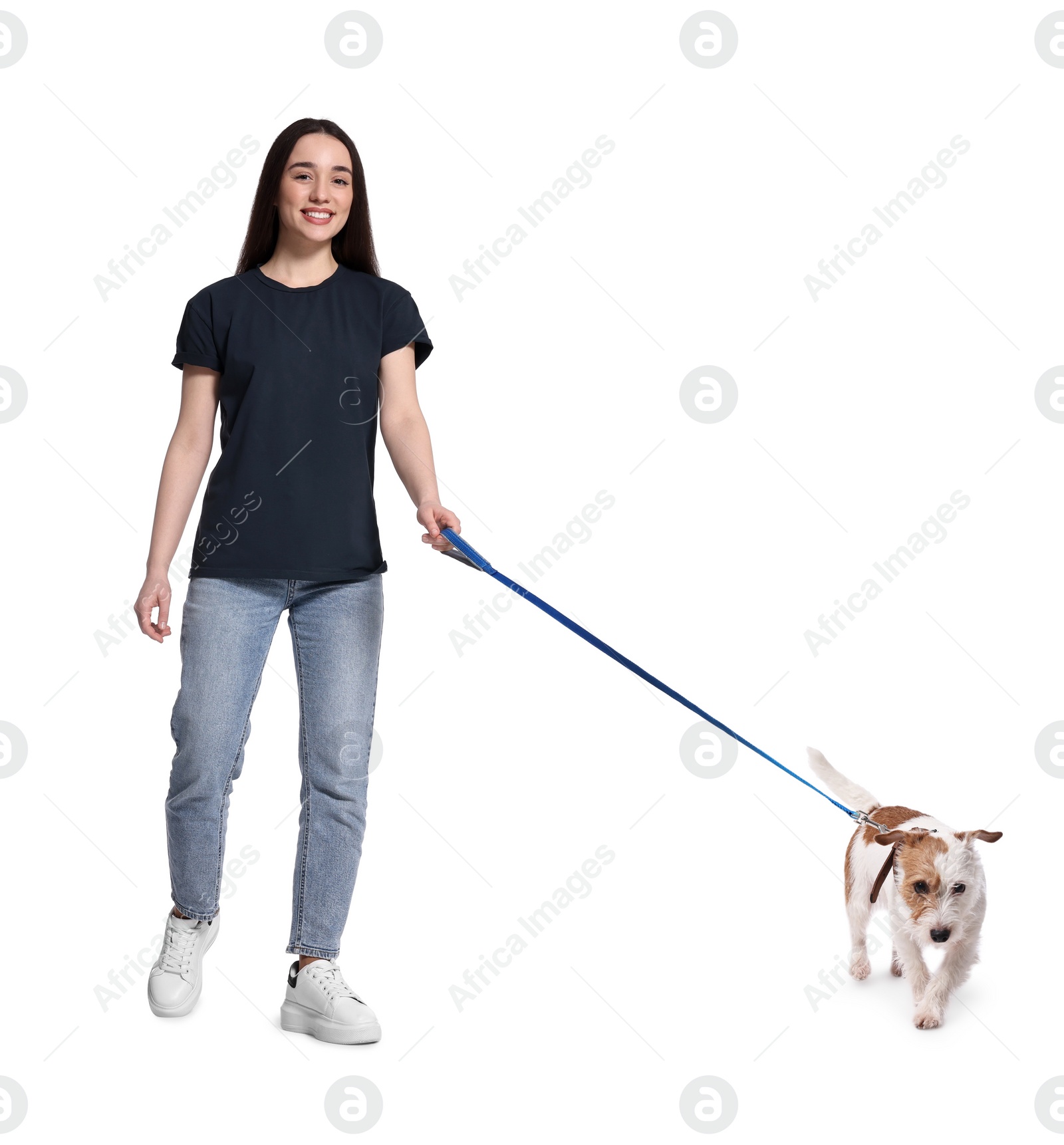 Image of Smiling woman walking with dog on white background