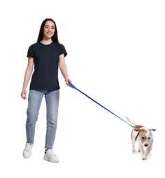 Smiling woman walking with dog on white background