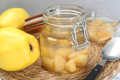 Photo of Delicious quince drink and fresh fruits on table, closeup