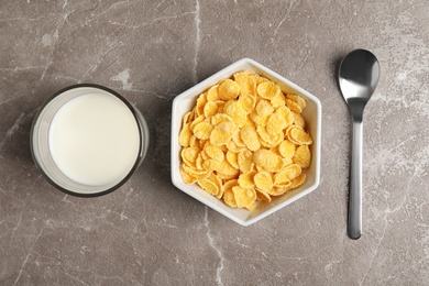 Photo of Flat lay composition with healthy cornflakes in bowl on table