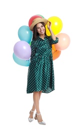 Photo of Young woman holding bunch of colorful balloons on white background