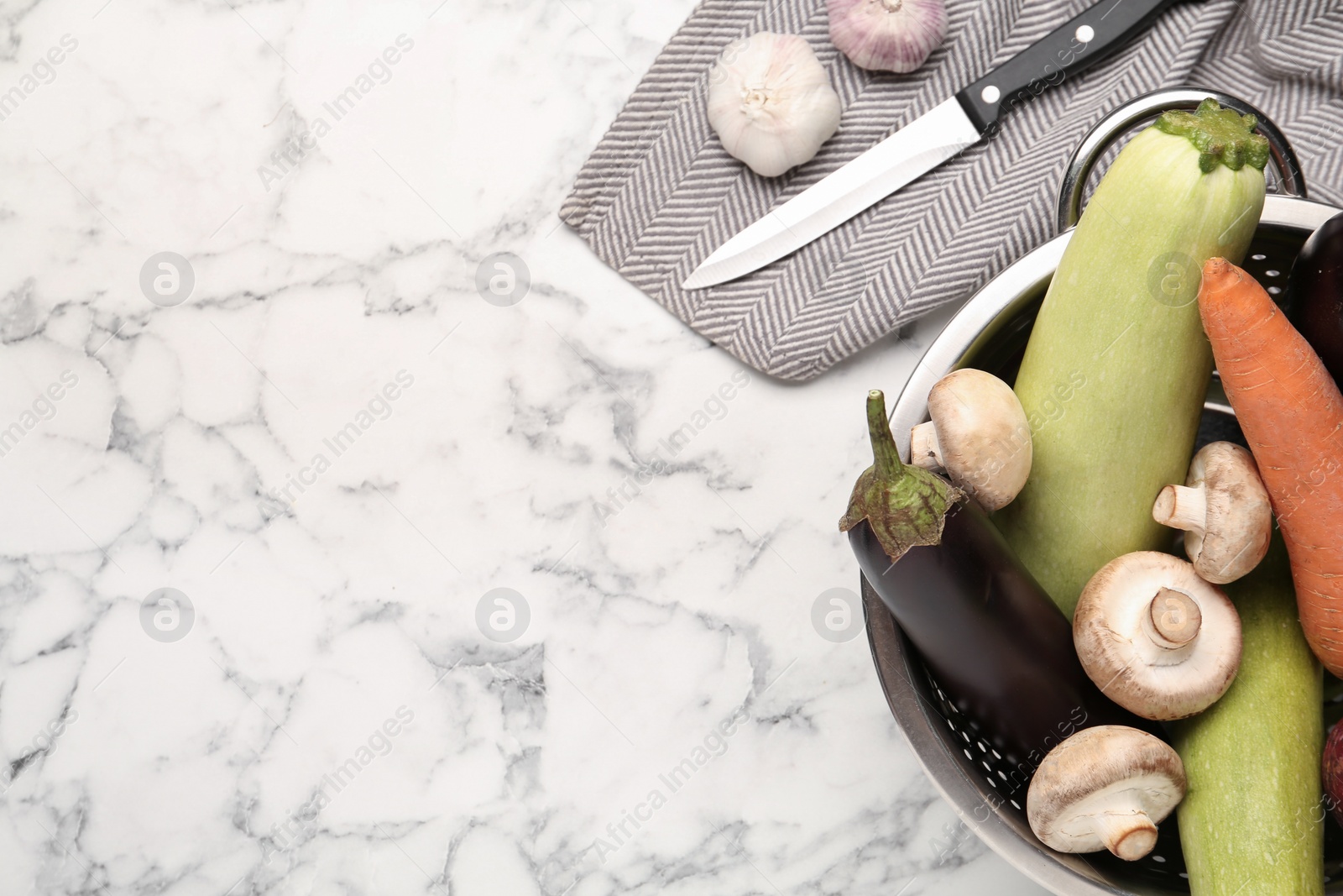 Photo of Fresh vegetables on white marble table, flat lay. Space for text