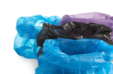 Photo of Many different plastic bags on white background