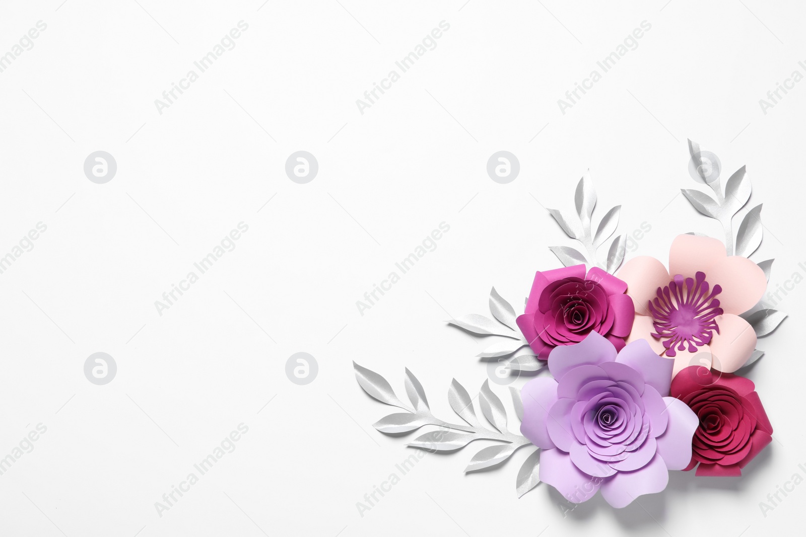 Photo of Different beautiful flowers and branches made of paper on white background, top view