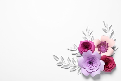 Photo of Different beautiful flowers and branches made of paper on white background, top view