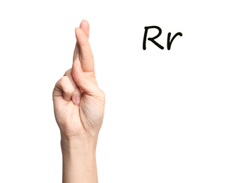 Image of Woman showing letter R on white background, closeup. Sign language