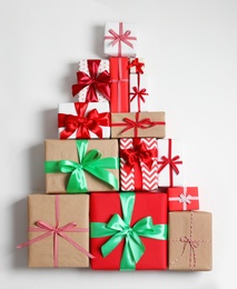 Photo of Beautifully wrapped gift boxes on white background