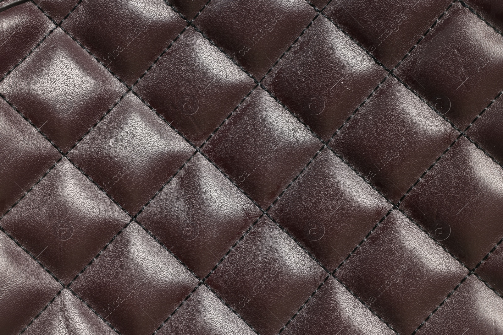 Photo of Brown natural leather with seams as background, top view