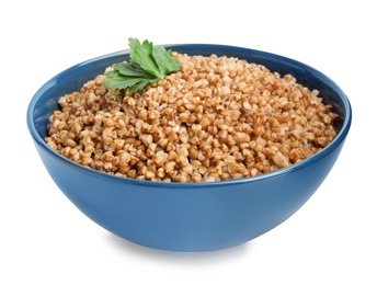 Photo of Bowl of buckwheat porridge with parsley isolated on white